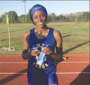 Kemper County senior Bry'Nesha Bourrage Bourrage won so many blue ribbons at the Region 3-2A rack meet that she needed both hands to hold them. She won the 200 and 400 meter events, as well as being part of two winning relay teams.